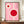 May include: Framed Bauhaus-style poster with pink background, white geometric circular forms, and red circles, displayed on wooden sideboard next to white ceramic vase and books in elegant room with cream walls and crown molding.