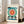May include: Framed Bauhaus-style poster with geometric design featuring large teal circle, radiating orange and red sunburst pattern, blue zigzag elements, and black angular shapes. Light wood frame leaning against white wall next to beige sofa in bright room with large windows and natural lighting.
