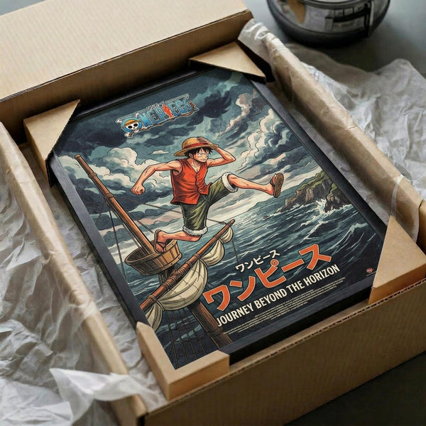 May include: One Piece anime poster featuring Luffy in red shirt and straw hat balancing on a small wooden sailboat amid stormy ocean waves. The vintage-style artwork shows dramatic cloudy skies and Japanese text at bottom. Black-framed print is nestled in cardboard packaging with white tissue paper, sitting on a neutral surface next to wrapped tubes.