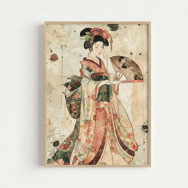 Framed vintage-style Japanese artwork showing an elegant geisha in flowing kimono with floral patterns in coral, green, and cream tones. She holds a decorative fan and wears an ornate hair ornament with flowers. The image has a weathered, aged appearance with subtle stains and spots on cream background, displayed in a simple light wood frame against white wall.