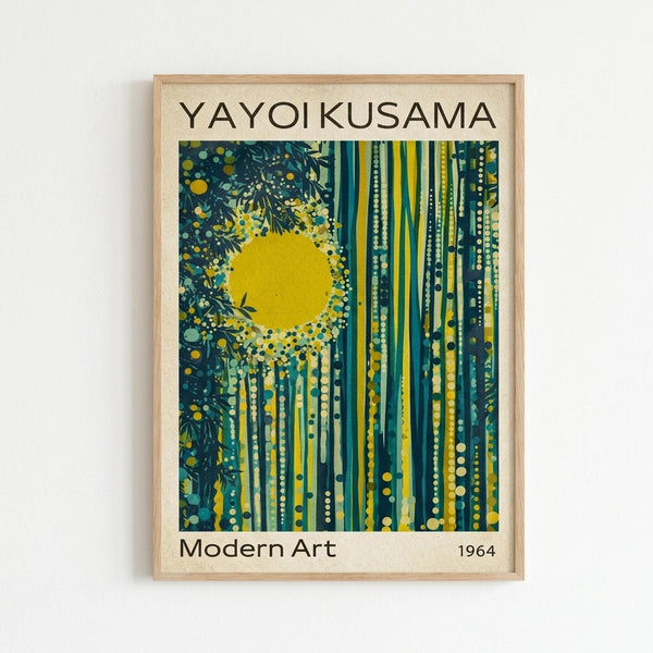 May include: Framed art print displayed on white wall featuring abstract design with bright yellow sun, dark teal and green vertical bamboo-like stalks, scattered polka dots, and foliage elements. Light wooden frame with cream matting against minimalist interior setting.