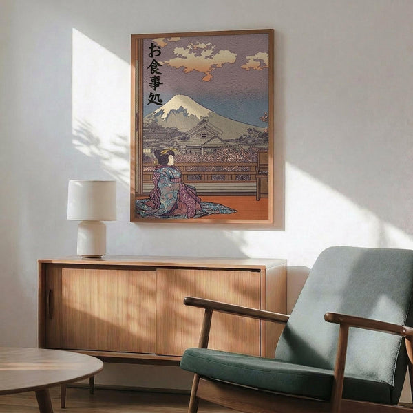 May include: Japanese ukiyo-e style artwork in wooden frame showing geisha in colorful kimono seated on wooden platform with snow-capped Mount Fuji and traditional buildings in background, displayed above mid-century modern walnut credenza with white ceramic lamp, next to sage green upholstered armchair with wooden arms in bright sunlit room with white walls