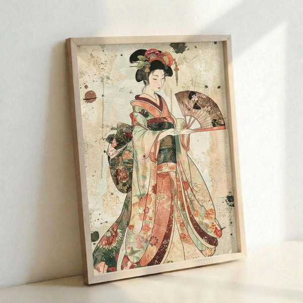 May include: Framed vintage-style Japanese artwork showing a geisha in colorful floral kimono holding a decorative fan, displayed in light wood frame against white wall. The print features weathered, distressed background with paint splatters and aging effects in muted earth tones.