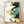 May include: Framed abstract art print leaning against white wall on light wood floor. Features flowing organic shapes in navy blue, sage green, and golden yellow with white negative space. Japanese calligraphy characters appear in top left corner. Natural wood frame with clean lines. Soft shadows cast across white textured wall from natural lighting.
