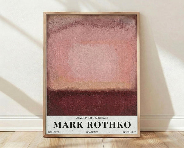 May include: Framed abstract art print with horizontal bands of dusty rose pink transitioning to deep burgundy red, displayed in light wood frame against white wall on wooden floor. The artwork shows textured, atmospheric color fields with soft gradients and painterly quality reminiscent of color field painting style.