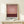 May include: Framed abstract art print in natural wood frame displaying gradient bands of deep burgundy, coral pink, and darker red tones in Rothko's color field style, displayed on light wooden console table with small wrapped gift box, against cream colored wall