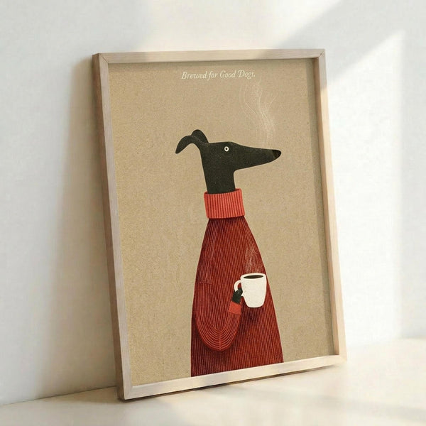 May include: Framed poster print leaning against white wall showing minimalist illustration of black greyhound wearing red ribbed turtleneck sweater and holding white coffee mug, with text "Brewed for Good Dogs" on beige textured background in natural wood frame