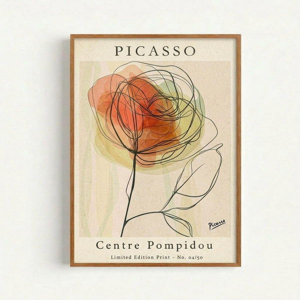Framed art print featuring an abstract line drawing of a rose with flowing, curved black lines forming layered petals in warm orange and coral watercolor washes, along with simple line-drawn leaves on a cream background, displayed against a white wall in a natural wood frame
