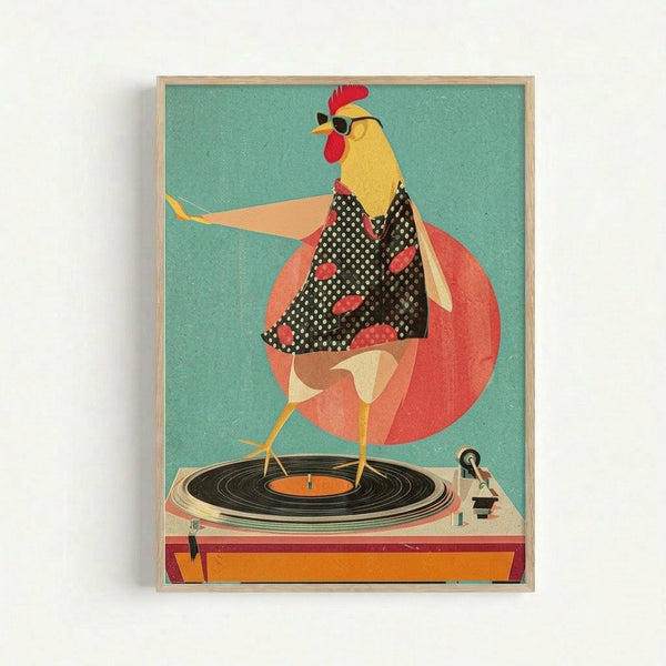 A stylized rooster wearing sunglasses and a black polka dot dress with red spots stands on a vintage turntable. The chicken has yellow feathers, a red comb and wattles, and strikes a disco pose with one wing extended. Behind the rooster is a large coral-pink circle against a teal background. The turntable is orange and cream colored with a black vinyl record. The artwork has a retro collage aesthetic with geometric shapes and is displayed in a light wood frame.