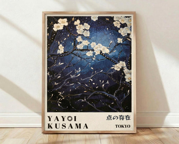May include: Framed art print featuring white cherry blossoms on dark blue night sky background with delicate branches and scattered white dots, displayed in light wood frame against white wall on wooden floor. Artwork shows Japanese-inspired floral design with gradient blue tones and flowing organic forms.