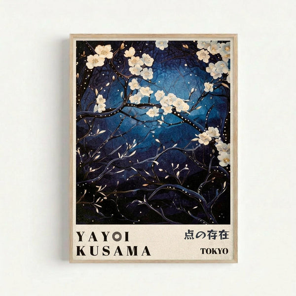 A framed art print featuring white cherry blossoms against a deep blue night sky filled with white dots resembling stars or snow. The delicate branches curve across the composition with scattered petals floating through the starry background. Below the artwork, text reads "YAYOI KUSAMA" and Japanese characters, with "TOKYO" in the corner. The print is displayed in a light wooden frame against a white wall.