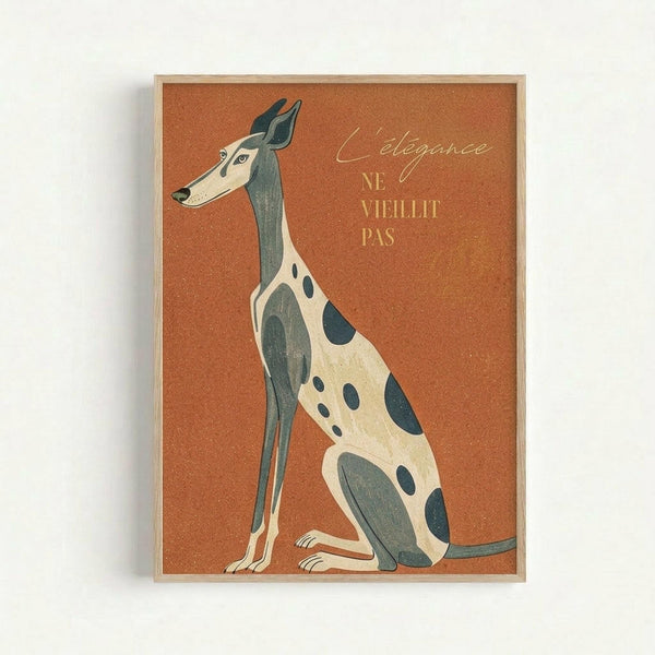 A stylized illustration of an elegant greyhound or whippet dog in profile against a warm orange-brown textured background. The dog features cream and sage green coloring with dark spots, rendered in a mid-century modern art style. French text reads "L'élégance ne vieillit pas" in golden lettering. The artwork is displayed in a light wooden frame against a white wall.