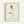 May include: Framed minimalist line drawing of a single rose with geometric colored shapes in yellow, rust red, and green on cream textured paper background. Simple black line art stem with leaves, signed "Picasso" in bottom right corner. Light wood frame mounted on white wall.
