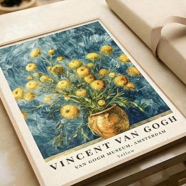 May include: Van Gogh museum poster print showing yellow chrysanthemum flowers in a brown vase against swirling blue brushstroke background, displayed on white bedding next to cream ribbon, featuring museum text at bottom