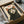 May include: Black and white tuxedo cat portrait print with yellow eyes and open mouth, featuring red "Meow" text, displayed in black frame inside cardboard shipping box with protective packaging materials on white surface