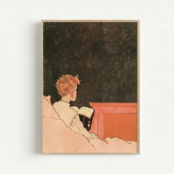 A vintage-style poster showing a person with reddish hair in white clothing, sitting in bed while reading a book and gazing up at a dark starry night sky. The illustration features warm peachy tones for the bedding and figure, contrasting with the deep black star-filled sky above. The artwork has a nostalgic early 20th century aesthetic with clean lines and muted colors, displayed in a simple light wood frame against a white wall.