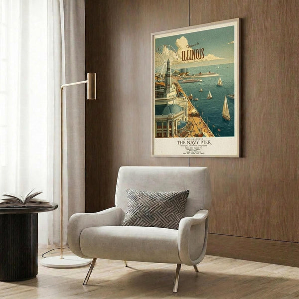 May include: Vintage-style Illinois Navy Pier travel poster in light wood frame, hung on wood-paneled wall above beige upholstered armchair with geometric patterned pillow. Poster shows aerial view of pier with ferris wheel, boats, and blue water in retro tourism advertisement style. Scene includes brass floor lamp and side table with open book.