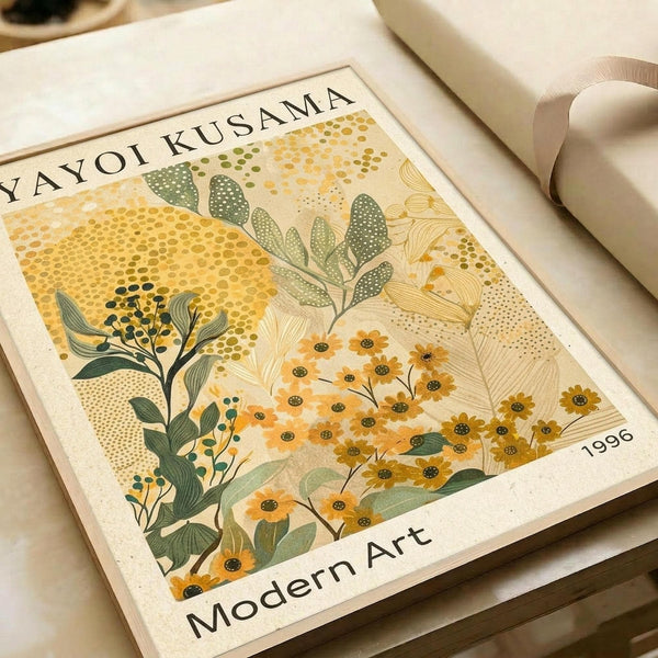 May include: Botanical art print displayed in an open book or portfolio, featuring stylized flowers and foliage in warm yellows, oranges and sage greens with dotted pattern backgrounds. The artwork shows delicate stems, leaves and blooms in a modern illustrative style against cream paper. Text reads "YAYOI KUSAMA" at top, "Modern Art" at bottom, and "1996" in corner.