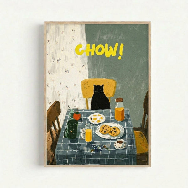Framed poster artwork showing a black cat sitting at a breakfast table with yellow text "CHOW!" above. The scene features a blue checkered tablecloth, wooden chairs, eggs, cookies on plates, orange juice, coffee, and kitchen items. The background has cream and sage green painted sections with visible brushstrokes in a rustic, hand-painted illustration style.