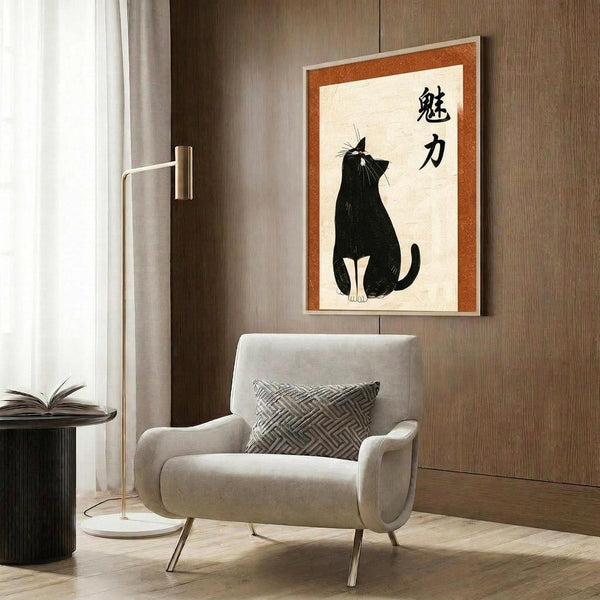 May include: Framed poster with Japanese calligraphy and black cat silhouette displayed on wood-paneled wall above beige upholstered chair with geometric pillow. Poster features orange border, cream background, sitting black cat, and two kanji characters. Modern living room setting with brass floor lamp and side table.