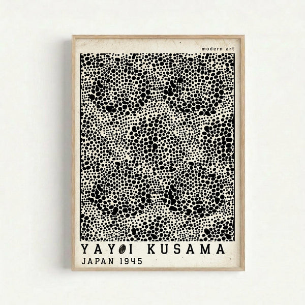 May include: Framed poster print with black polka dot pattern on cream background, mounted on white wall. Light wood frame surrounds artwork featuring dense clusters of varied-sized black circles creating organic, cellular-like formations. Text reads "modern art" at top, artist name and "JAPAN 1945" at bottom in black letters.