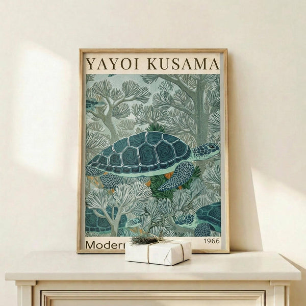 May include: Framed poster featuring a sea turtle swimming among coral in muted green and teal tones, displayed on a light wood console table next to a small wrapped gift with twine bow against a cream wall