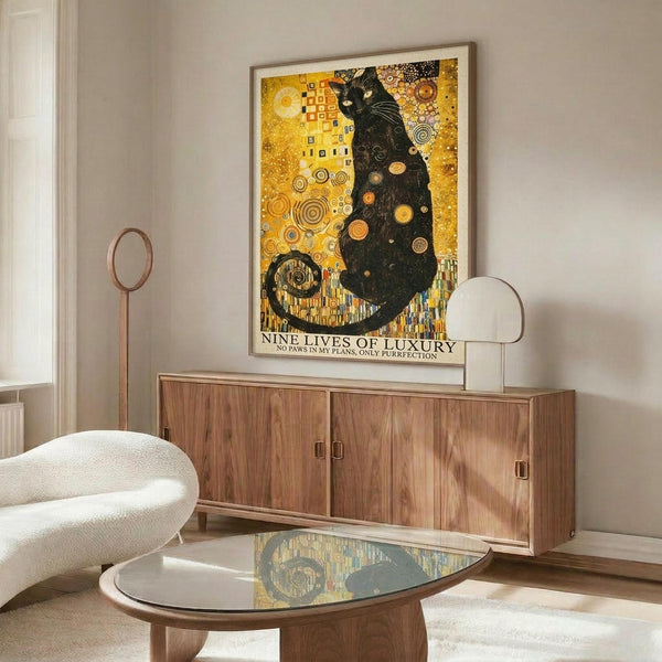 May include: Framed art print displayed above wooden sideboard in modern living room. Artwork features black cat in golden Art Nouveau style with geometric patterns and circular motifs. Room includes white curved chair, glass-top coffee table, and floor lamp. Warm lighting creates reflections on furniture surfaces.