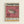May include: Framed vintage-style exhibition poster with wooden frame hanging on cream wall. Features detailed illustration of spotted pufferfish on coral pink background. Black text reads "EXHIBITION" at top and Japanese characters at bottom. Includes dates "JUN 05-20 1974", San Francisco Japantown address, gallery hours, and artist names. Retro museum poster design with beige and burgundy color blocks.