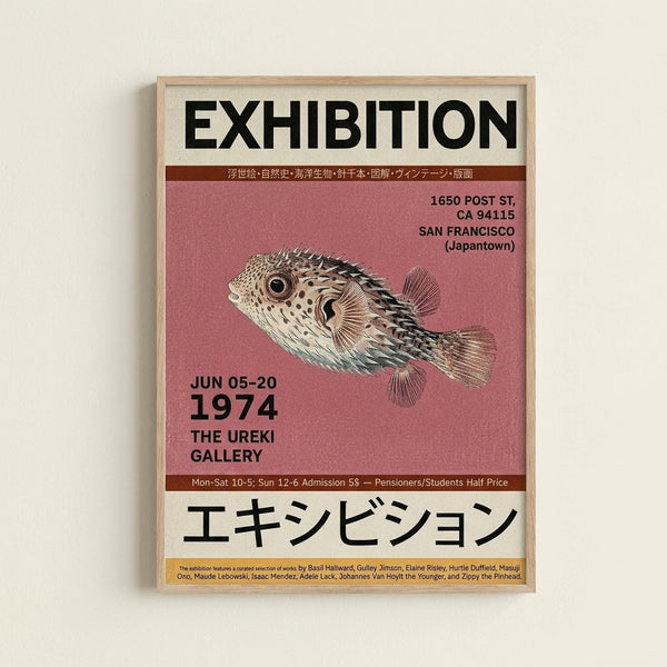 May include: Framed vintage-style exhibition poster with wooden frame hanging on cream wall. Features detailed illustration of spotted pufferfish on coral pink background. Black text reads "EXHIBITION" at top and Japanese characters at bottom. Includes dates "JUN 05-20 1974", San Francisco Japantown address, gallery hours, and artist names. Retro museum poster design with beige and burgundy color blocks.