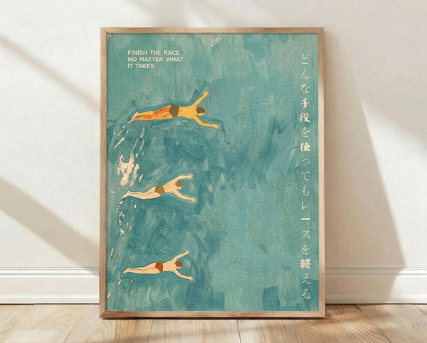 May include: Framed poster with turquoise watercolor background showing three swimmers in different diving and swimming poses. English text "Finish the race no matter what it takes" appears at top left, with vertical Japanese characters on the right side. Natural wood frame sits on light wooden floor against white wall with soft shadows from window light.