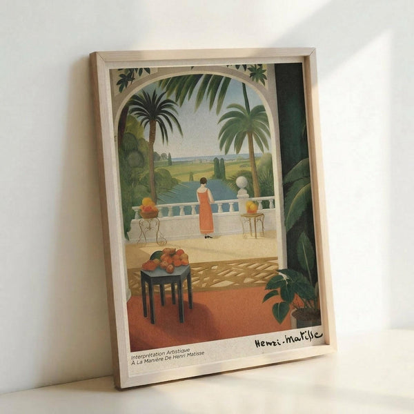 May include: Framed art print in light wood frame leaning against white wall. Tropical scene shows figure in orange dress on terrace overlooking water, with palm trees, ornate archway, and fruit bowl on small table. Warm colors include greens, oranges, and blues in painterly style reminiscent of mid-century modern art.