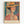 A stylized portrait of a woman wearing an orange wide-brimmed hat with dark ribbon, rendered in vibrant geometric patterns and bold colors including oranges, teals, and earth tones. The artwork features decorative tropical and abstract motifs in the background with chevron and leaf patterns. The piece is displayed in a light wood frame against a white wall, with "HENRI MATISSE PARIS" text at the bottom in a vintage exhibition poster style.
