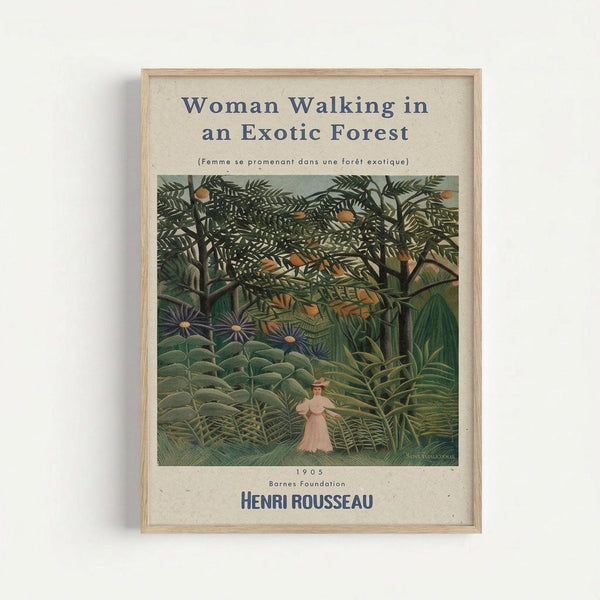 Framed art print showing Henri Rousseau's 1905 painting "Woman Walking in an Exotic Forest" with French subtitle. The artwork depicts a small figure in a pink dress walking through a lush jungle scene with dense green foliage, tropical plants, and colorful flowers. The print has cream-colored matting around the image with the artist's name and date at the bottom, all contained within a light wood frame against a white wall.
