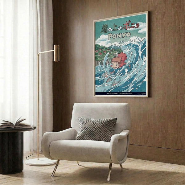 May include: Framed Ponyo poster displayed on wood-paneled wall above beige upholstered chair with geometric pillow. Poster shows red-haired character riding ocean wave in anime art style with Japanese text and turquoise background. Modern room setting with brass floor lamp and round side table.