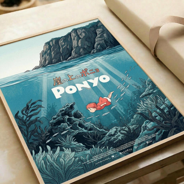 May include: Vintage-style poster print featuring an underwater scene with a small red-haired character swimming among coral and seaweed, with rocky cliffs visible above the waterline. The artwork displays in muted blue-green tones with Japanese text and white English lettering. The print sits on a beige surface next to rolled paper tubes, showing the poster's square format and detailed illustration style.
