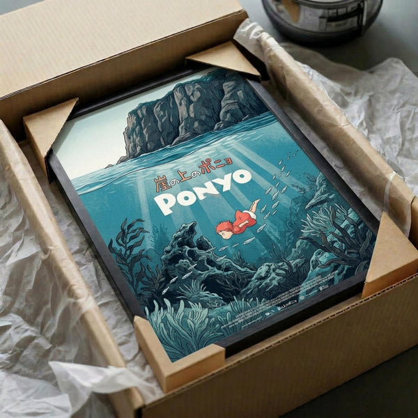 May include: Framed poster featuring underwater scene with red-haired character swimming among dark seaweed and coral formations beneath towering cliffs. Artwork displays vintage-style illustration in blue and teal tones with Japanese text. Print shown in black frame, carefully packed in cardboard shipping box with protective tissue paper on white surface.