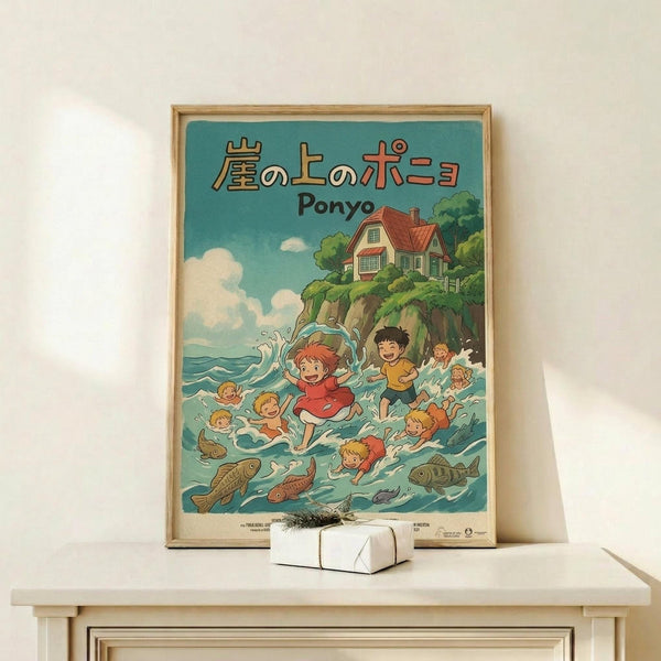 May include: Framed Studio Ghibli Ponyo poster displayed on light wood shelf against white wall. Artwork shows children swimming in turquoise ocean water with fish, featuring red-haired Ponyo character prominently. House on cliff visible in background with blue sky and white clouds. Poster has thin natural wood frame. Small white wrapped gift box sits on shelf in front of poster. Clean, minimalist room setting with natural lighting casting soft shadows.