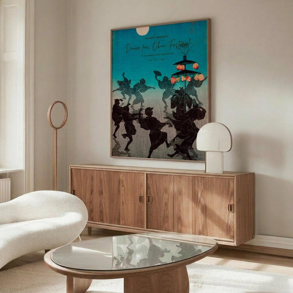 May include: Japanese art poster with turquoise background showing black silhouettes of dancing figures in traditional clothing, displayed above a mid-century modern walnut credenza. White mushroom table lamp and brass floor lamp beside cream curved chair with glass oval coffee table in bright, minimalist living room setting.