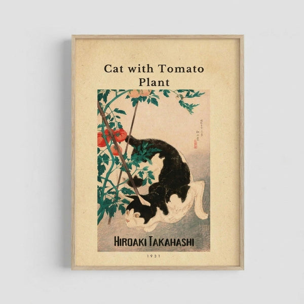 Framed vintage Japanese woodblock print showing a black and white cat sitting beside a tall tomato plant with red tomatoes and green leaves. The artwork has a cream-colored background with Japanese calligraphy in the upper right corner. The print is mounted in a light wooden frame against a white wall, with the artist name "Hiroaki Takahashi" and date "1931" displayed below the image on the cream matting.