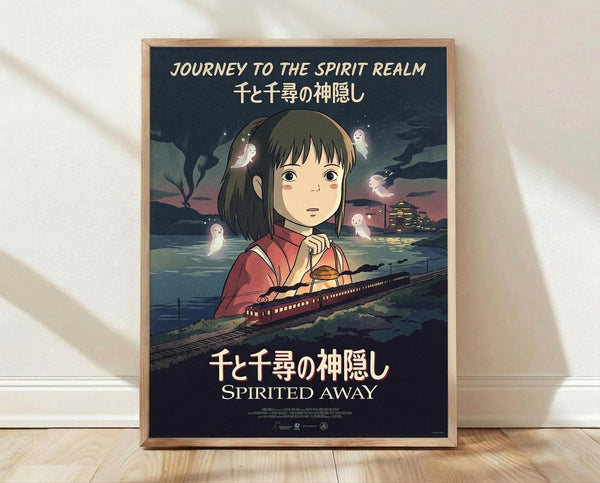 May include: Framed anime movie poster featuring a young girl with brown hair in red clothing, surrounded by small white spirits and a train crossing water at twilight. The poster displays "Journey to the Spirit Realm" and "Spirited Away" text in English and Japanese characters. The wooden frame sits against a white wall on light wooden flooring with soft natural lighting creating gentle shadows.