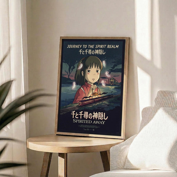 May include: Framed Spirited Away movie poster featuring anime girl character Chihiro in red kimono against dark blue background with train and floating spirits, displayed on round wooden side table next to beige upholstered chair and plant in bright sunlit room with white walls