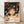May include: Framed poster print leaning against white wall on light wooden floor. Features anime-style illustration of young girl with brown hair and large eyes, surrounded by swirling white spirits. Background shows mystical bathhouse interior with warm orange and green lighting, traditional architecture, and glowing lanterns. Japanese text and "SPIRITED AWAY" title at bottom in burgundy lettering. Natural wood frame with warm lighting and soft shadows across scene.