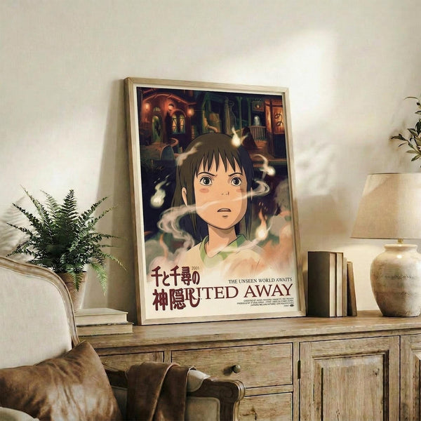 May include: Framed Spirited Away movie poster featuring anime character Chihiro with short brown hair and green shirt, surrounded by white spirits against mystical bathhouse background. Japanese and English text below. Wooden frame displayed on rustic dresser with plant, books, and ceramic vases in modern living room setting.