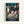 May include: Framed Studio Ghibli Spirited Away movie poster mounted on white wall. Features young girl with short dark hair holding small object, surrounded by translucent spirits in traditional Japanese bathhouse setting with red lanterns and multi-story architecture. Artwork displays rich blues, greens, and warm tones in classic anime illustration style with Japanese and English text at bottom.