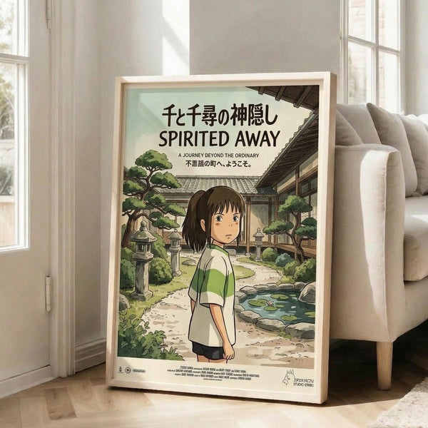 May include: Framed Spirited Away movie poster leaning against white wall next to beige armchair in bright living room. Poster shows anime girl with dark hair in green and white striped shirt standing in traditional Japanese garden setting with stone lanterns, pond, and wooden buildings. Light wood frame, natural lighting from windows.