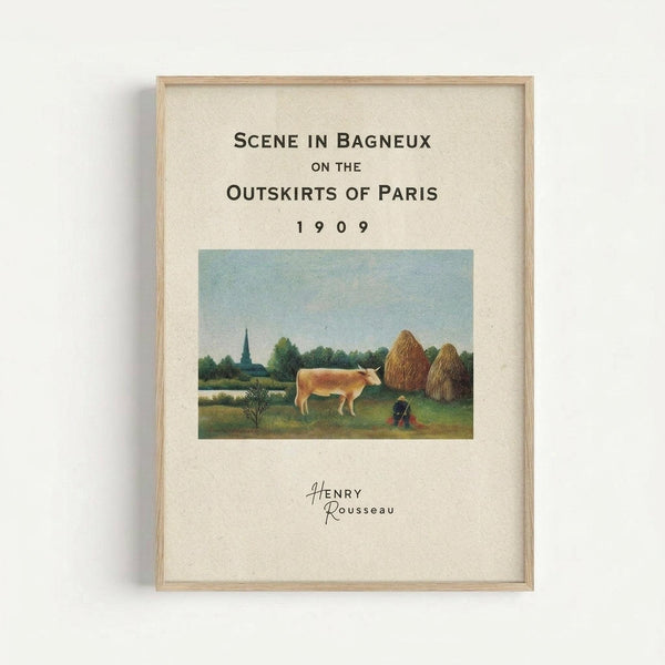 Framed art print featuring Henri Rousseau's pastoral painting of a cream-colored cow grazing in a green field with haystacks and trees in the background. The print has text reading "Scene in Bagneux on the Outskirts of Paris 1909" and "Henry Rousseau" on cream-colored paper within a light wood frame, displayed against a white wall.