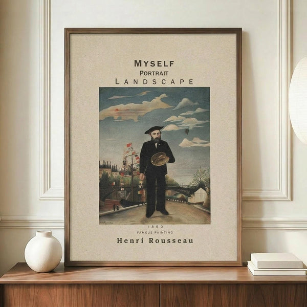 May include: Framed art print of Henri Rousseau's 1890 self-portrait showing a bearded man in black coat holding palette, standing before industrial landscape with bridge and buildings under cloudy sky. Cream matting with brown wooden frame displayed on walnut credenza beside white ceramic vase and stacked books against neutral wall with white trim molding.