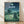 May include: Framed poster displaying nighttime scene with large gray forest creature, two small children, lush green landscape, crescent moon and starry sky with constellation lines. Wooden frame leaning against white wall on light wood floor. Soft natural lighting creates gentle shadows.