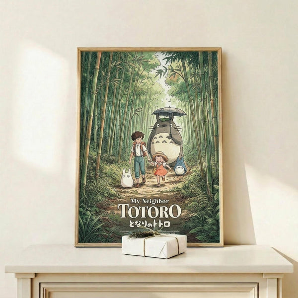 May include: Framed poster featuring characters from animated film in bamboo forest setting, displayed on light wood console table beside small white wrapped gift box against cream wall with natural lighting