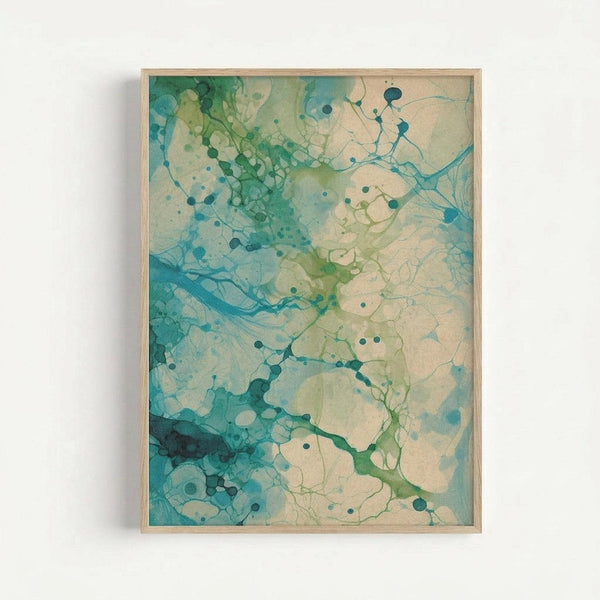 Framed abstract artwork with organic flowing forms in teal, turquoise, and sage green watercolor-like ink blots against cream background. Delicate branching lines connect circular spots throughout the composition. Natural wood frame hangs on white wall, creating soft shadow.